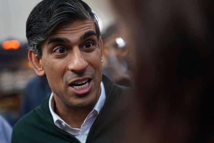 Rishi Sunak meets members of the public during a visit to Altrincham market in Greater Manchester.