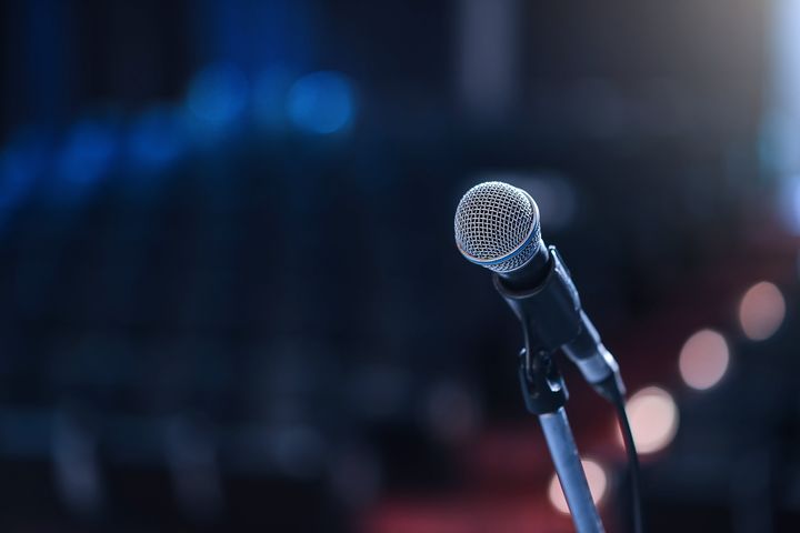 A radio reporter fired from his job over his standup comedy act will be reinstated after an arbitrator declared that his jokes were actually pretty funny.
