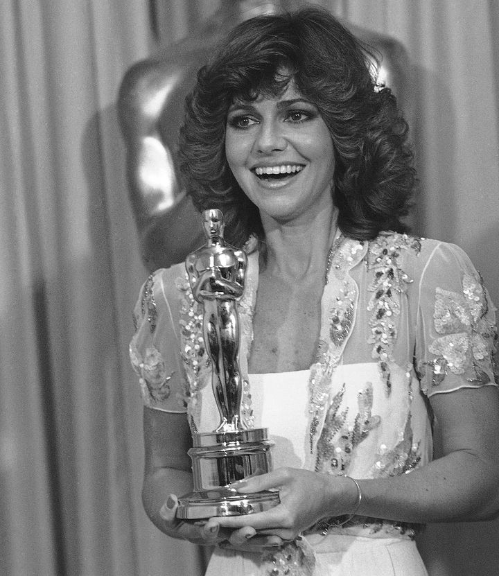 Field holds her Oscar for "Norma Rae."