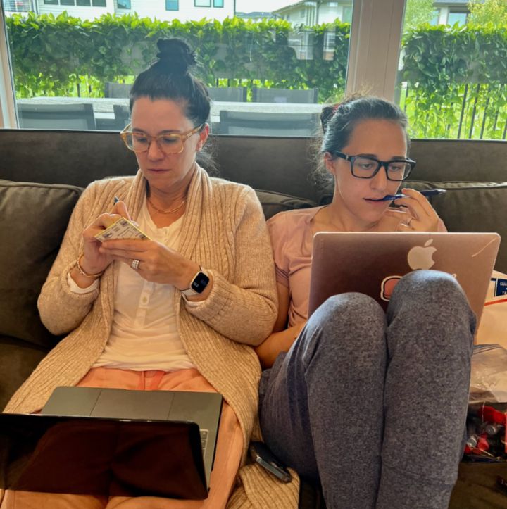 The author (left) writing her memoir with her daughter Rachael.