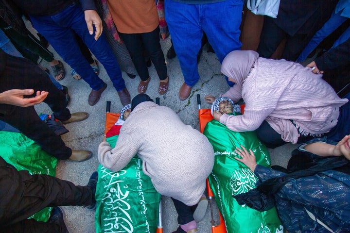 Palestinians mourn over the bodies of Palestinian people killed by the Israeli army, during their funeral ceremony on Jan. 7, 2024, in Jenin, West Bank. Seven Palestinians were killed today during an Israeli airstrike on Jenin.