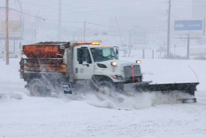 A snow plow clears the parking lot outside the Horizon Family Restaurant, the venue where Republican presidential candidate former U.N. Ambassador Nikki Haley was scheduled to hold a campaign event, on Jan. 8, 2024 in Sioux City, Iowa. The event was cancelled due to inclement weather. 