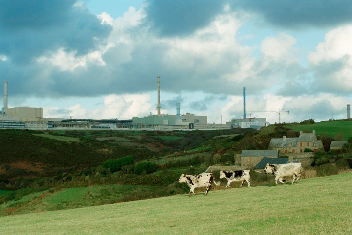 In the background, the COGEMA factory rises from the landscape. The factory at La Hague specializes in the treatment of used nuclear fuels discarded from reactors owned by French, European and Asian electrical companies. The treatment consists of separating, then packaging the different components, gleaning recyclable fuels, such as Uranium and Plutonium, from non-recyclable components, which contain the majority of the radioactivity, for safe containment.