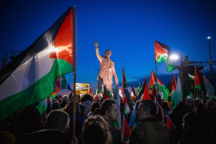 Palestinians carrying flags and banners gather at the Nelson Mandela Square to demonstrate support of the genocide case filed by the Republic of South Africa against Israel at the International Court of Justice (ICJ), on Jan. 10, 2024 in Ramallah, occupied West Bank.