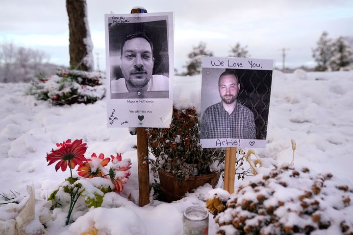 Pictures of two of the victims of the October mass shooting are seen at a makeshift memorial in Lewiston, Maine.