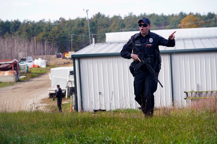 A police officer gives an order to the public during a manhunt for Robert Card at a farm in October.