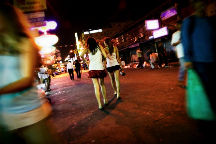 Bangkok, Thailand - March 1st, 2007 : Two kathoey Lady boys in Khao San Road at night.