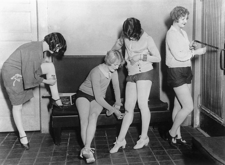 Women shaving their legs with mechanical razors in New York City in 1927.