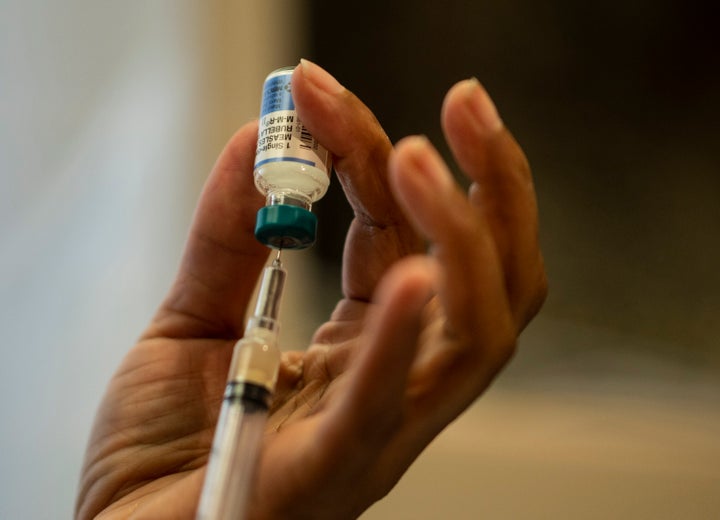 A nurse prepares the measles, mumps and rubella vaccine at a New York hospital. 