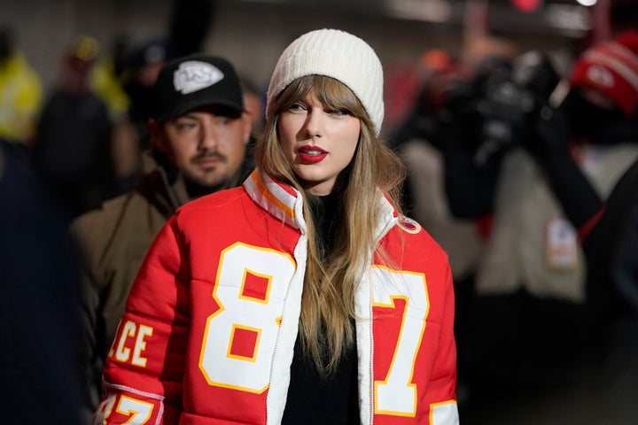 Taylor Swift wears a Kansas City Chiefs tight end Travis Kelce jacket as she arrives before an NFL wild-card playoff football game between the Chiefs and the Miami Dolphins Saturday, Jan. 13, 2024, in Kansas City, Mo. (AP Photo/Ed Zurga)