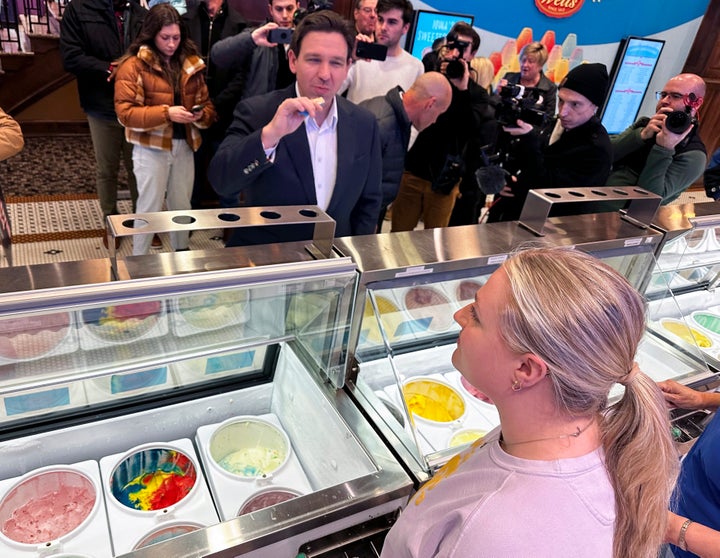 Florida Gov. Ron DeSantis samples praline pecan before ordering a cone at the Blue Bunny Ice Cream Parlor in LeMars, Iowa, Thursday, Jan. 11, 2024. The parlor is a common stop for Republicans when campaigning in northwest Iowa, where social conservatives carry outsize influence in Iowa's Republican caucuses and where DeSantis and Trump are competing aggressively for evangelical conservatives. (AP Photo/Thomas Beaumont)