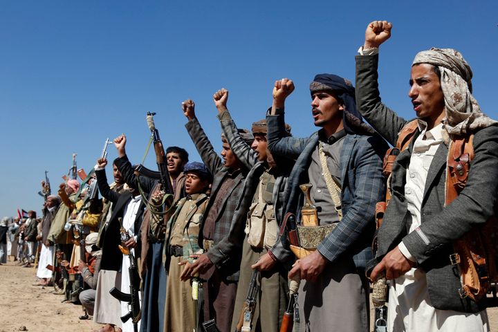 Houthi fighters and tribesmen stage a rally against the U.S. and the U.K. strikes on Houthi-run military sites near Sanaa, Yemen, on Jan. 14, 2024.