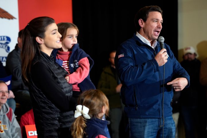 Republican presidential candidate Florida Gov. Ron DeSantis points to his wife Casey and their children as he speaks at a campaign event, Sunday, Jan. 14, 2024, in Ankeny, Iowa. (AP Photo/Charlie Neibergall)