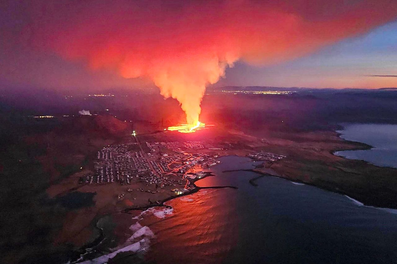 Billowing smoke and flowing lava are seen in this image during an volcanic eruption on Sunday on the outskirts of the evacuated town of Grindavík.