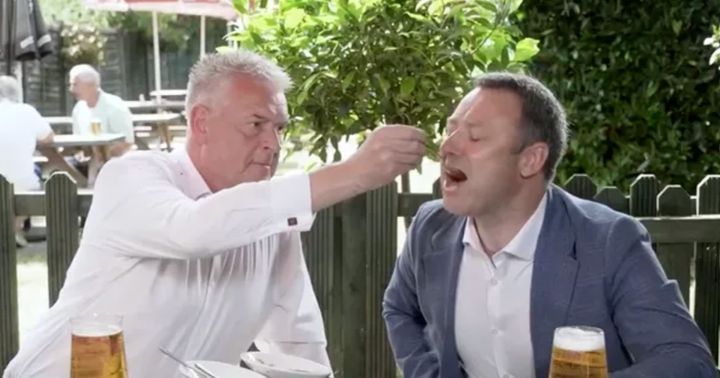 Lee Anderson feeds fellow Tory rebel Brendan Clarke-Smith with a spoon.