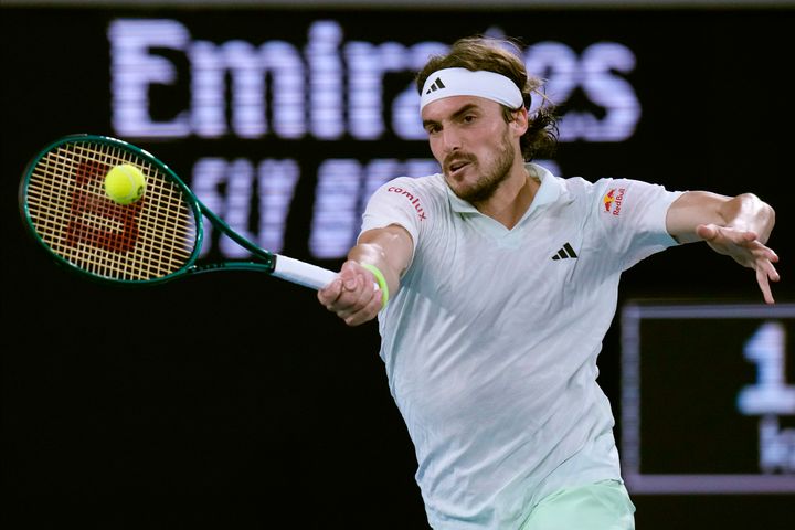 Stefanos Tsitsipas of Greece plays a forehand return to Jordan Thompson of Australia during their second round match at the Australian Open tennis championships at Melbourne Park, Melbourne, Australia, Wednesday, Jan. 17, 2024. (AP Photo/Andy Wong)