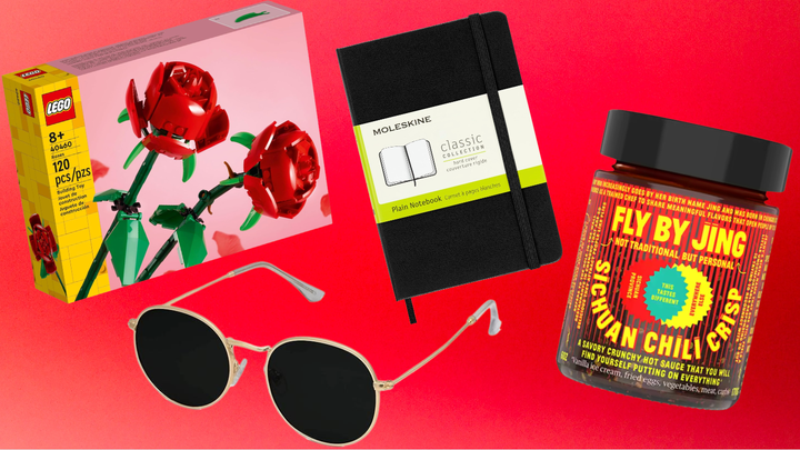 Lego roses, Moleskin notebook, Fly By Jing chili crisp and round sunglasses.
