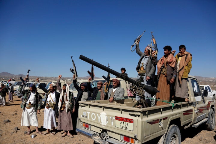 Houthi fighters and tribesmen stage a rally against the U.S. and the U.K. strikes on Houthi-run military sites near Sanaa, Yemen, on Jan. 14, 2024. 