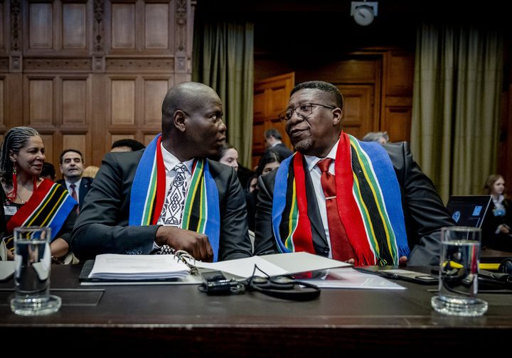 South African Minister of Justice Ronald Lamola and South African Ambassador to the Netherlands Vusimuzi Madonsela attend the International Court of Justice (ICJ) ahead of the hearing of the genocide case against Israel brought by South Africa, in The Hague on January 11, 2024. South Africa is hoping a litany of dehumanizing statements by Israel against Palestinians will show the country's intent of committing genocide.