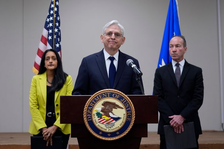 Attorney General Merrick B. Garland (center) with Associate Attorney General Vanita Gupta (left) and COPS Director Hugh Clements Jr. speaks during a news conference where they shared the findings of a federal report into the law enforcement response to Uvalde's school shooting.