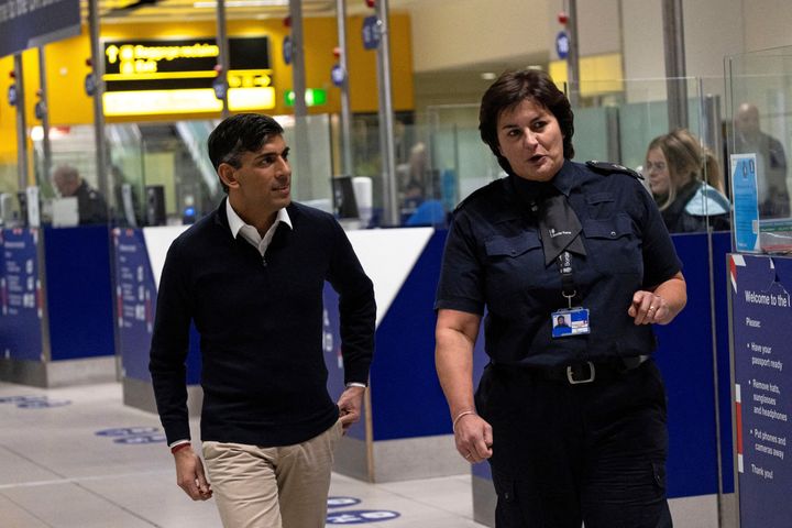 Rishi Sunak tours passport control during a visit to Gatwick Airport yesterday.