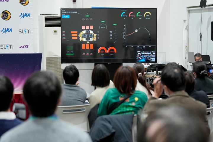 Journalists watch a live streaming of the pinpoint moon landing operation by the Smart Lander for Investigating Moon (SLIM) spacecraft at JAXA's Sagamihara Campus Saturday, Jan. 20, 2024, in Sagamihara near Tokyo. (AP Photo/Eugene Hoshiko)