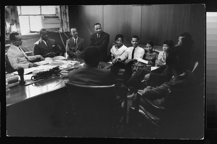 The Rev. Martin Luther King Jr. (center) holds a September 1960 strategy meeting with college students, including Julian Bond, who organized a sit-in attempting to end Atlanta's lunch counter segregation.