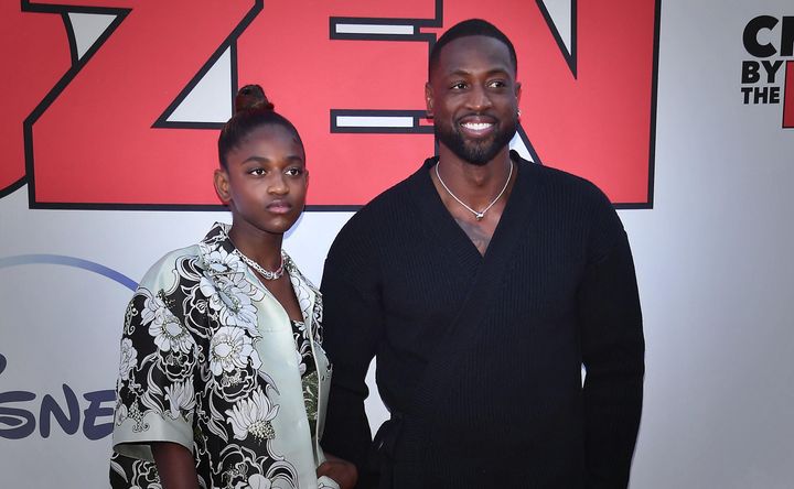 Former professional basketball player Dwyane Wade and his daughter, Zaya Wade, arrive for the 