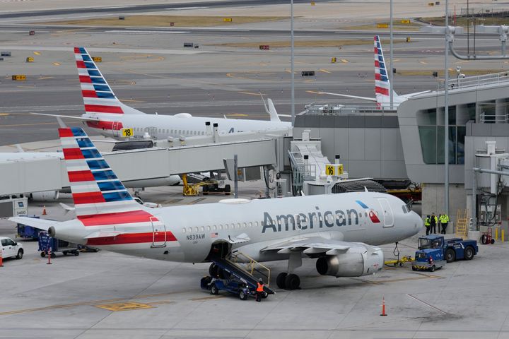 American Airlines planes sit on the runway of LaGuardia Airport on January 11, 2023 in New York.