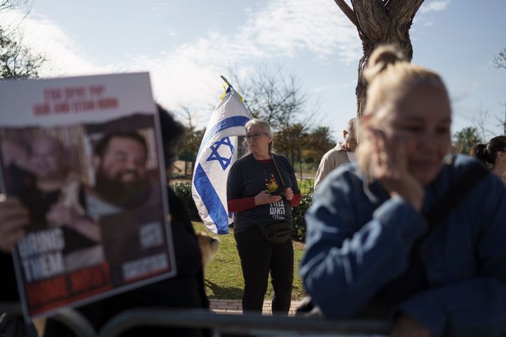 People gather outside the private residence of the Israeli Prime Minister Benjamin Netanyahu, in Caesarea, Israel, Saturday, Jan. 20, 2024. (AP Photo/Leo Correa)