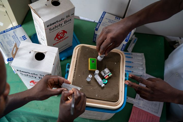 Health officials prepare to vaccinate residents of the Malawi village of Migowi, on Dec. 10, 2019, where young children become test subjects for the world's first vaccine against malaria. 