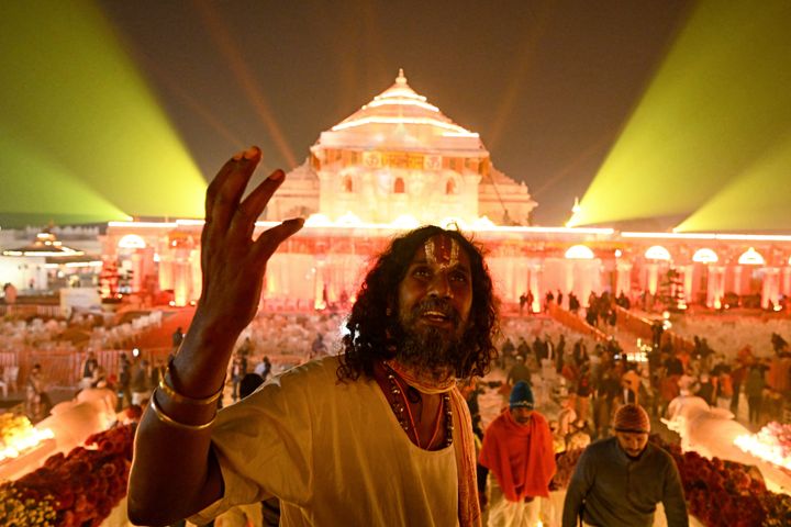 Hindu devotees gather near the illuminated Ram temple following its consecration ceremony in Ayodhya in India's Uttar Pradesh state on January 22, 2024. Prime Minister Narendra Modi said the opening of the temple, built on the ruins of a razed historic mosque, heralded a "new era" for India, at a ceremony that embodies the triumph of his Hindu nationalist politics.