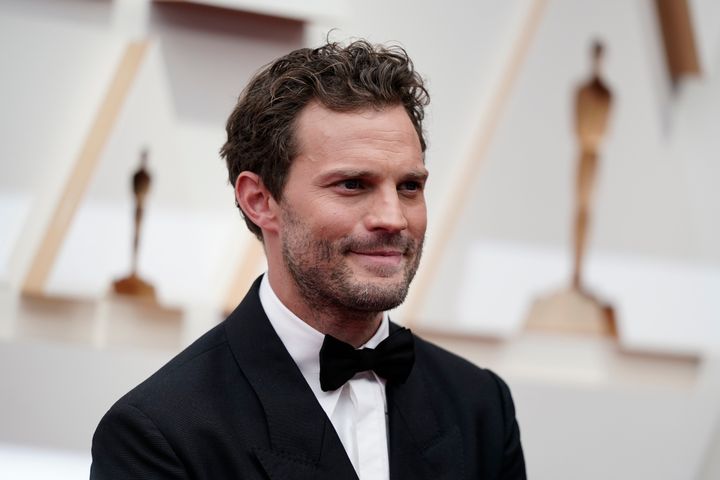Jamie Dornan arrives at the Oscars on March 27, 2022. The actor's friend told the BBC's “The Good, the Bad and the Unexpected” radio show how they both came down with a mystery illness during a vacation in Portugal last year.