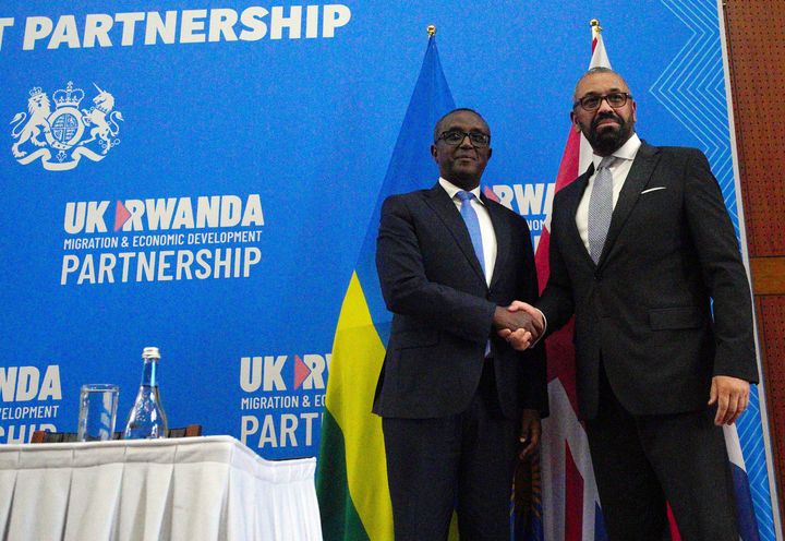 Britain's home secretary James Cleverly, right, and Rwandan minister of foreign afairs Vincent Biruta hold a joint news conference after signing a new treaty in Kigali, Rwanda, in December.