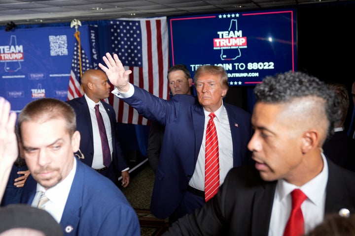 Republican presidential candidate former President Donald Trump waves to supporters at a campaign event in Laconia, N.H., Monday, Jan. 22, 2024. (AP Photo/Matt Rourke)