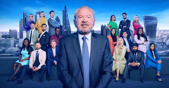 Alan Sugar posing with the 18 new Apprentice candidates
