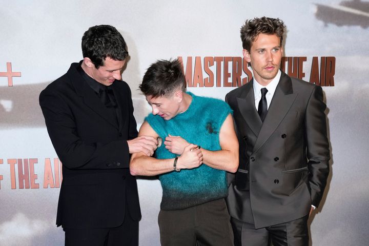 Callum Turner feels co-star Barry Keoghan's bicep on the red carpet