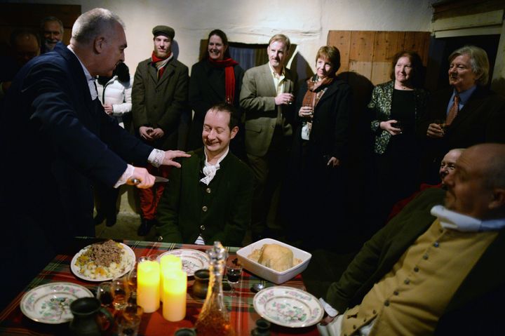 A group re-enact the first ever Burns Supper held in 1801 