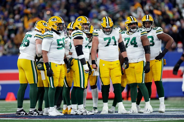 Green Bay Packers players huddle after a Dec. 11 game with the New York Giants.