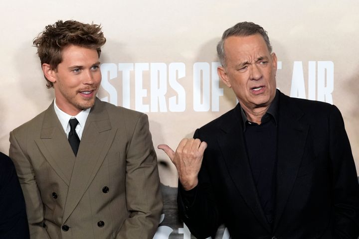Tom Hanks (right) starred opposite Austin Butler in "Elvis" and purportedly helped him find a role in “Masters of the Air."