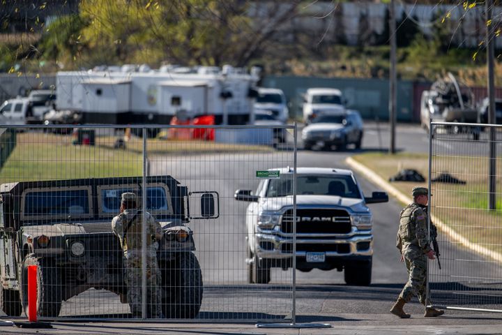 Texas National Guard soldiers stand guard at an entrance to Shelby Park on Jan. 12, 2024 in Eagle Pass where they are blocking Border Patrol from accessing the Rio Grande River.
