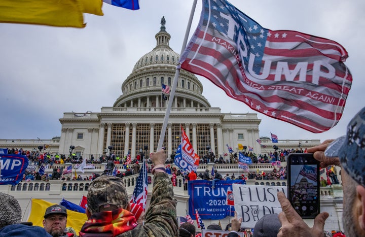 WASHINGTON,DC-JAN6: Supporters of President Trump storm the United States Capitol building. (Photo by Evelyn Hockstein/For The Washington Post via Getty Images)