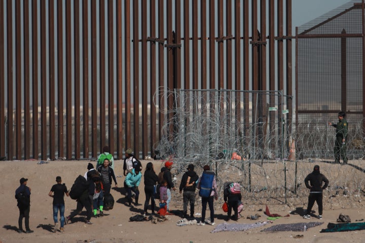 Migrants in Mexico try to reach the U.S. border to seek humanitarian asylum on Jan. 17. They managed to cross the river and overcome obstacles including barbed wire set up by authorities.