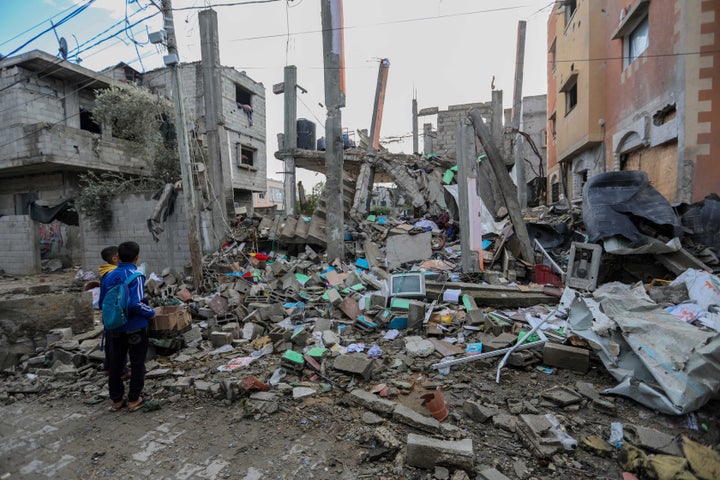 RAFAH, GAZA - JANUARY 27: People inspect damage to their homes caused by Israeli air strikes, on January 27, 2024 in Rafah, Gaza. (Photo by Ahmad Hasaballah/Getty Images)