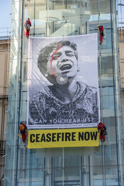 Unmute Gaza teamed up with Greenpeace to unfurl a gigantic banner on the Reina Sofia Museum in Madrid, Spain.