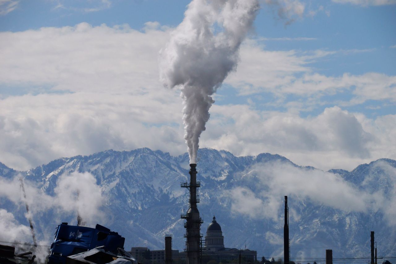 The Utah state Capitol is seen behind an oil refinery on May 12, 2022, in Salt Lake City.