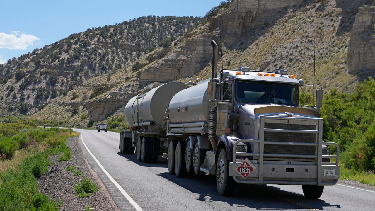 A tanker truck transports oil through the Uinta Basin south of Duchesne, Utah, on July 13, 2023.