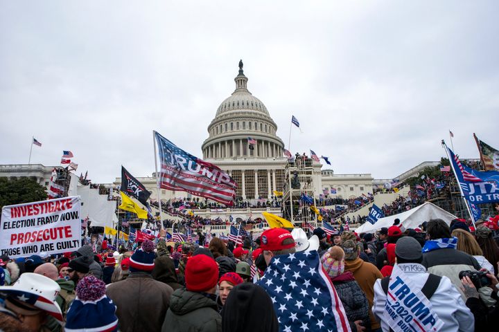 Rioters loyal to President Donald Trump rally at the U.S. Capitol in Washington, D.C., on Jan. 6, 2021. On Jan. 28, 2024, a retired judge recommended to Illinois election officials that Trump's name should be removed from the Illinois primary ballot, but that the decision should be left to the courts.
