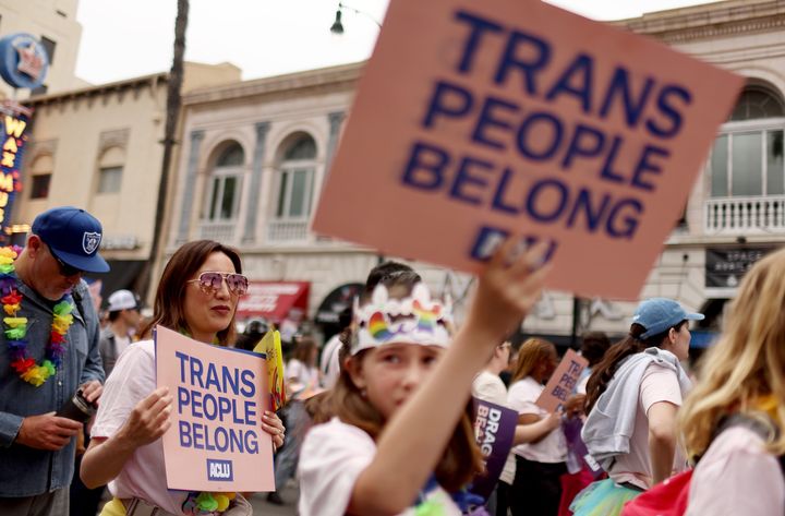 LOS ANGELES, CALIFORNIA - JUNE 11: ACLU march participants carry signs in support of rights for transgender people during the 2023 LA Pride Parade in Hollywood on June 11, 2023 in Los Angeles, California. The annual parade draws thousands of revelers to Hollywood Boulevard. According to the American Civil Liberties Union, nearly 500 anti-LGBTQ+ bills have been introduced across the U.S. in state legislatures since the beginning of 2023. (Photo by Mario Tama/Getty Images)