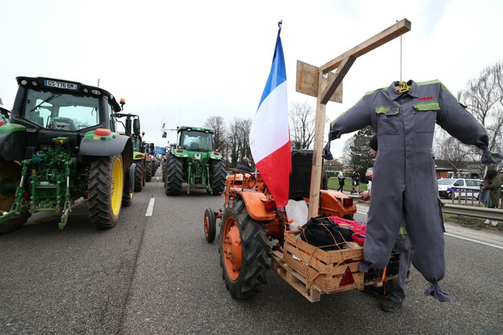 A mannequin hangs during a protest called by local branches of major farmer unions FNSEA and Jeunes Agriculteurs, blocking the A35 highway with tractors near Strasbourg on Jan. 30.